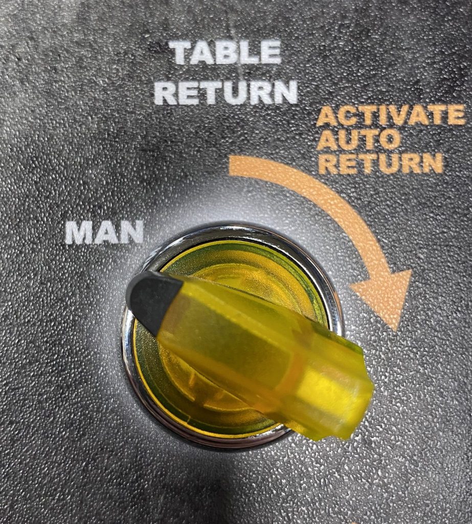 MANUAL / ACTIVATE AUTO TABLE RETURN SWITCH